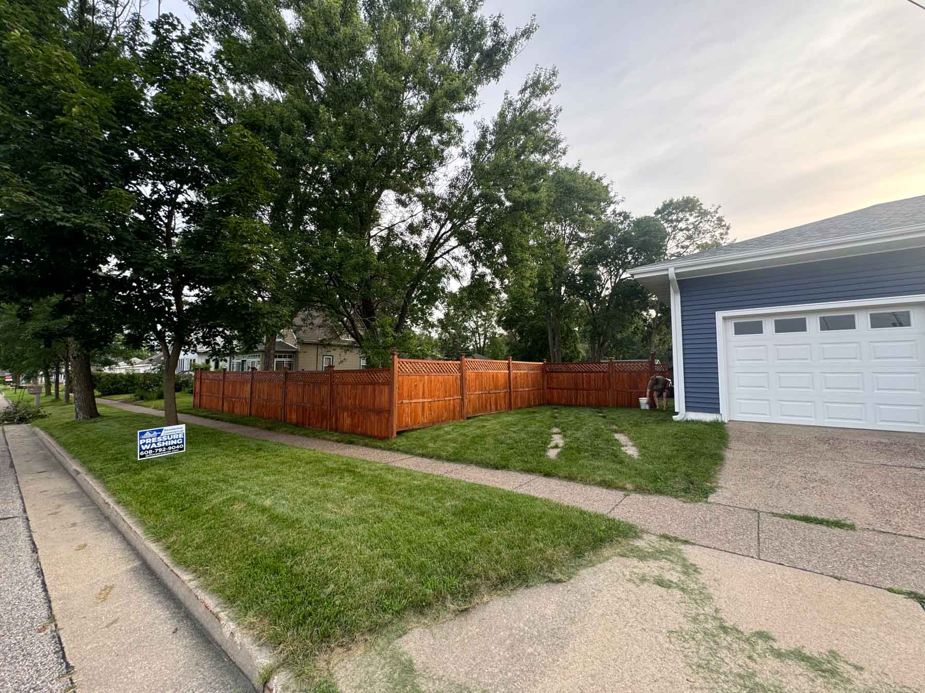Fence Restoration 17 After Image Of A Fence In A Yard After It Has Been Stained By Driftless Exteriors