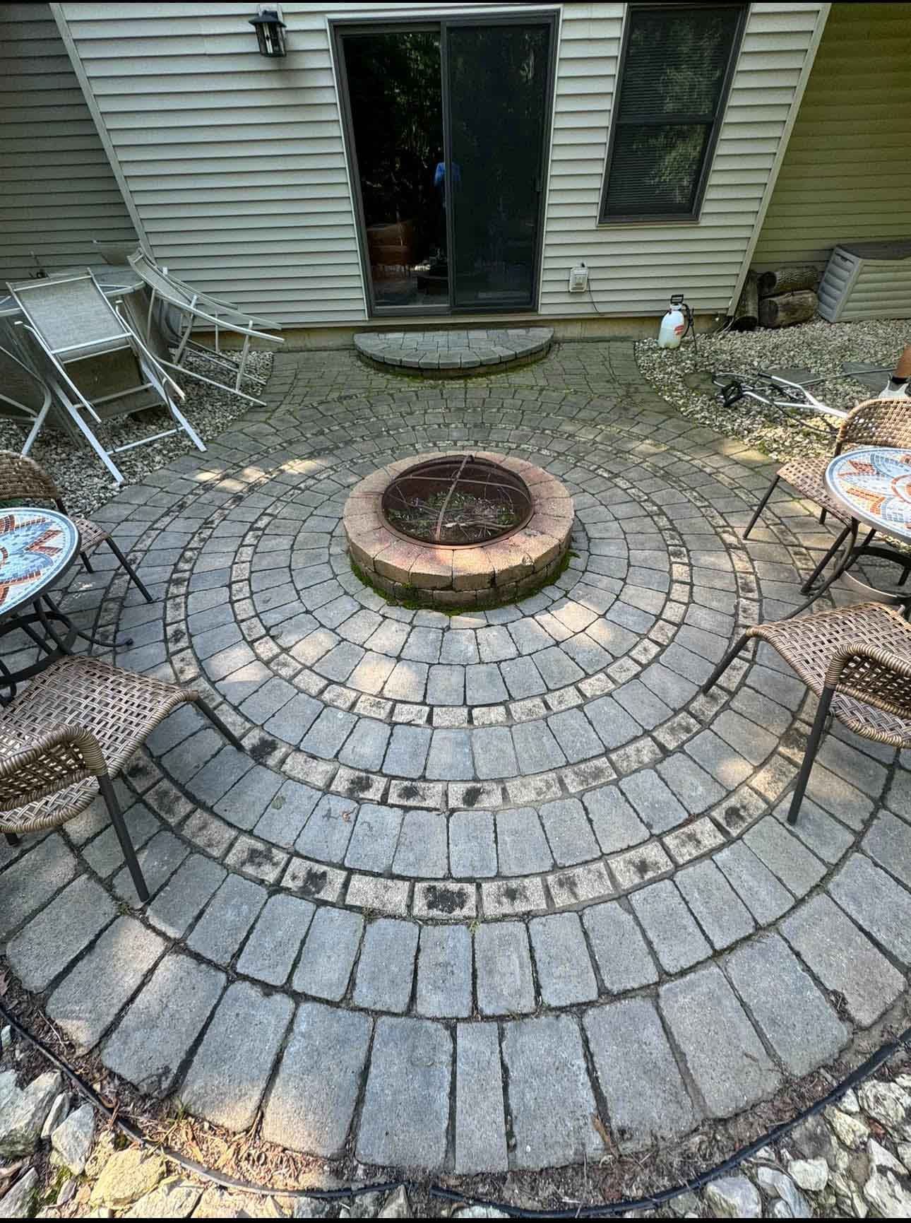 Paver Cleaning 42 Patio With Fire Pit Before Being Cleaned By Driftless Exteriors